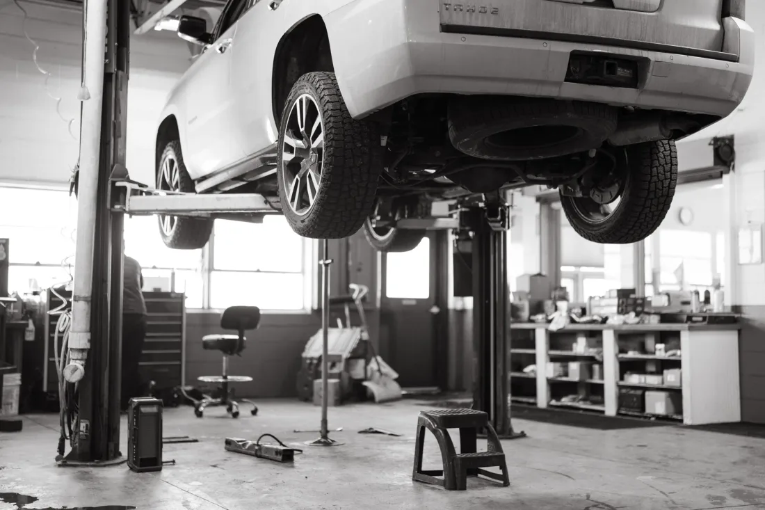 Vehicle on a service lift at a Revix Repair shop